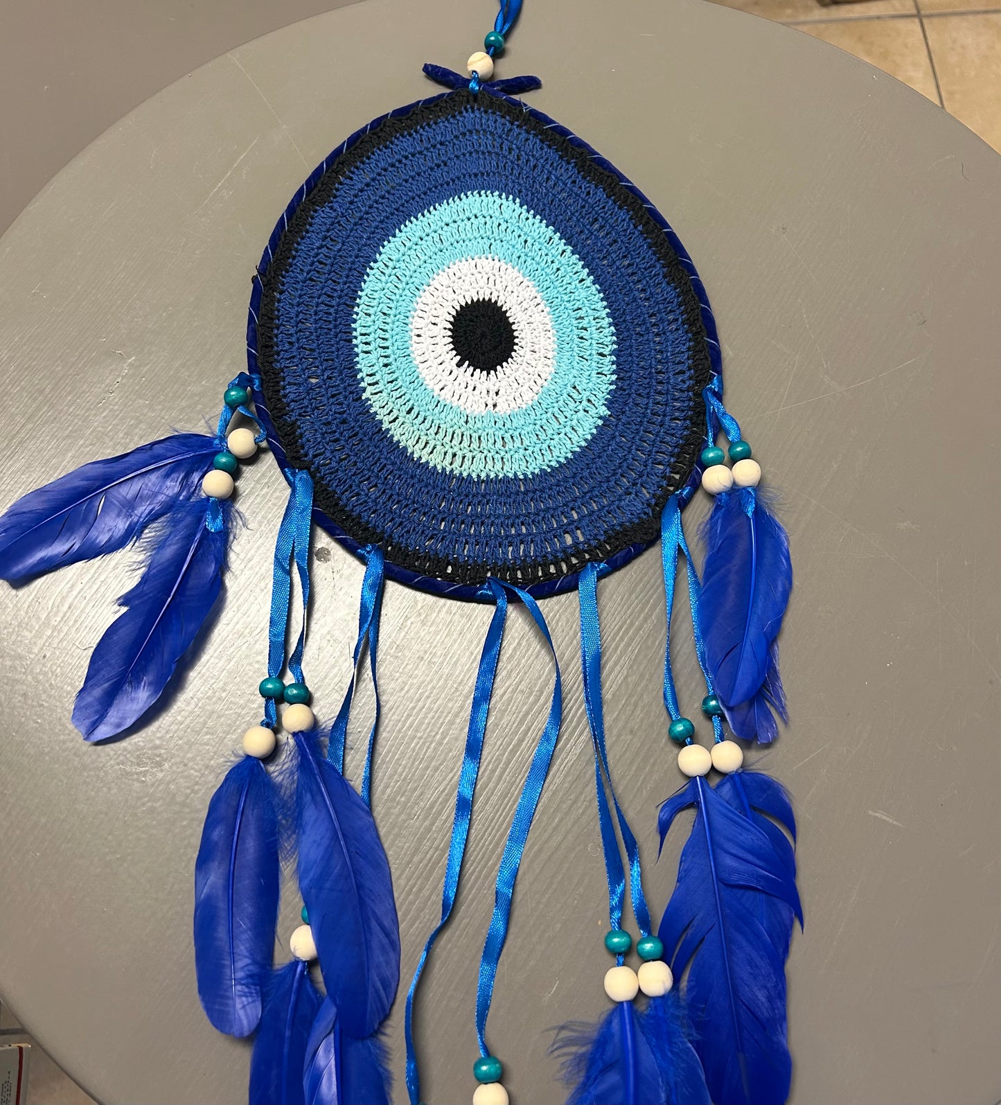 Large Dream Catcher Featuring Crochet Evil Eye Center and Blue Feathers