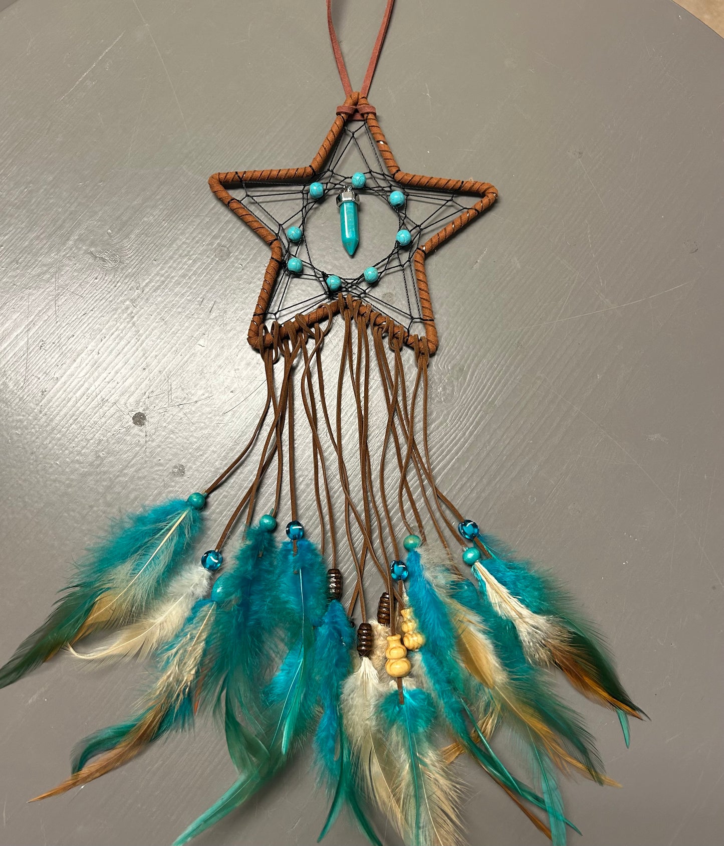 Small Dream Catcher Featuring a Star Design and Turquoise Colored Beads